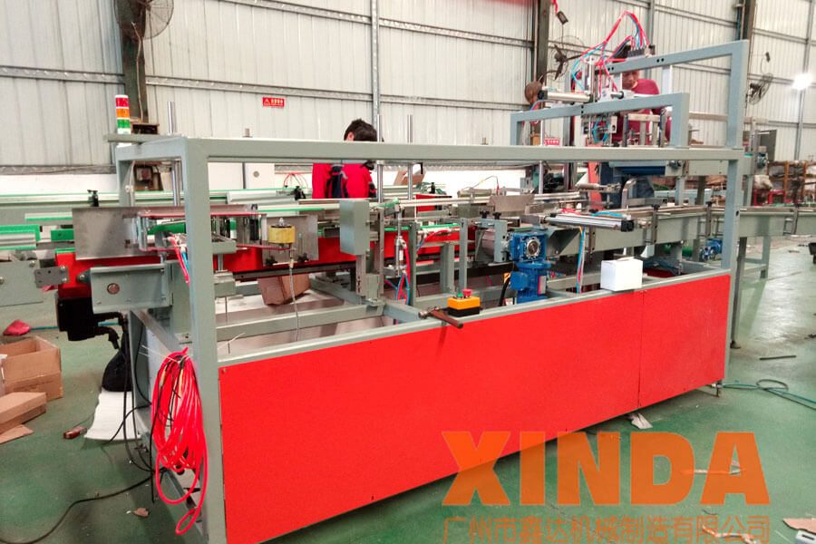 新型小盒子開裝封一體機,自動裝箱機,方盒裝箱機-廣州鑫達機械